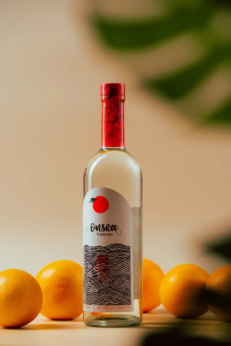 Onsra Triple Sec bottle with oranges